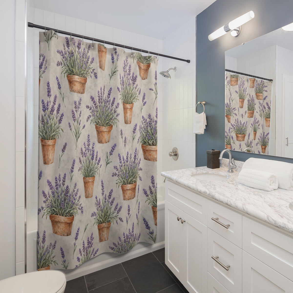 Purple lavender in terracotta pots on pale gray shower curtain beside a white vanity