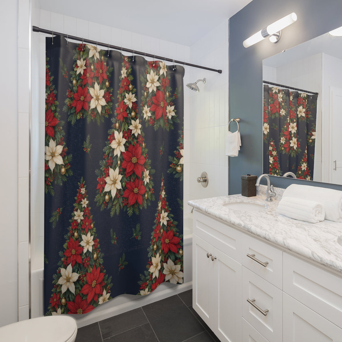 Red and ivory poinsettia Christmas trees on navy shower curtain beside a white vanity