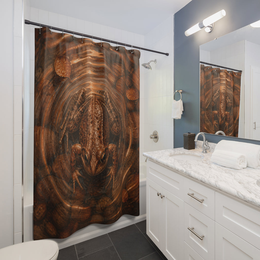 Brown frog centered in copper pond ripples shower curtain beside a white vanity