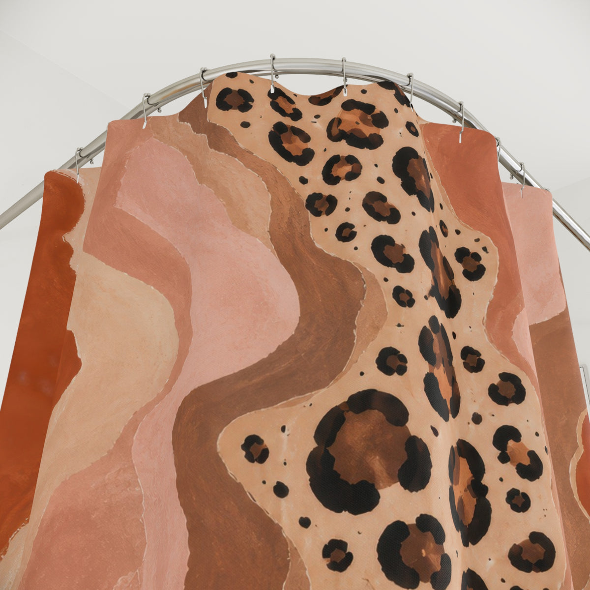 Cheetah print flowing through terracotta canyon shapes shower curtain with close-up print, hooks, and folds