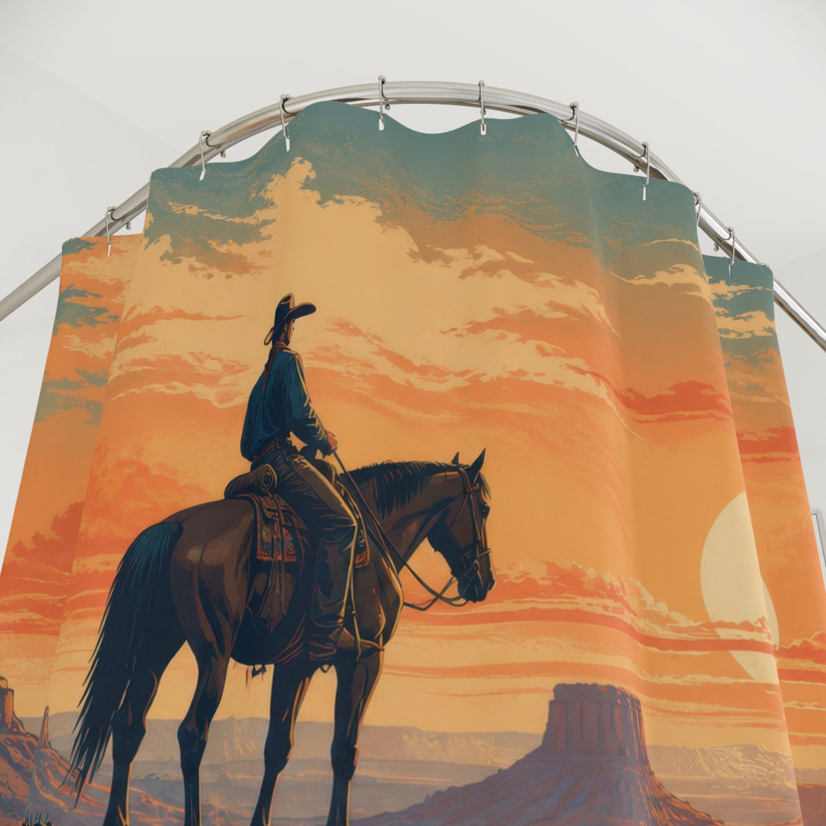 Cowboy riding a horse across a sunset desert ridge shower curtain with close-up print, hooks, and folds