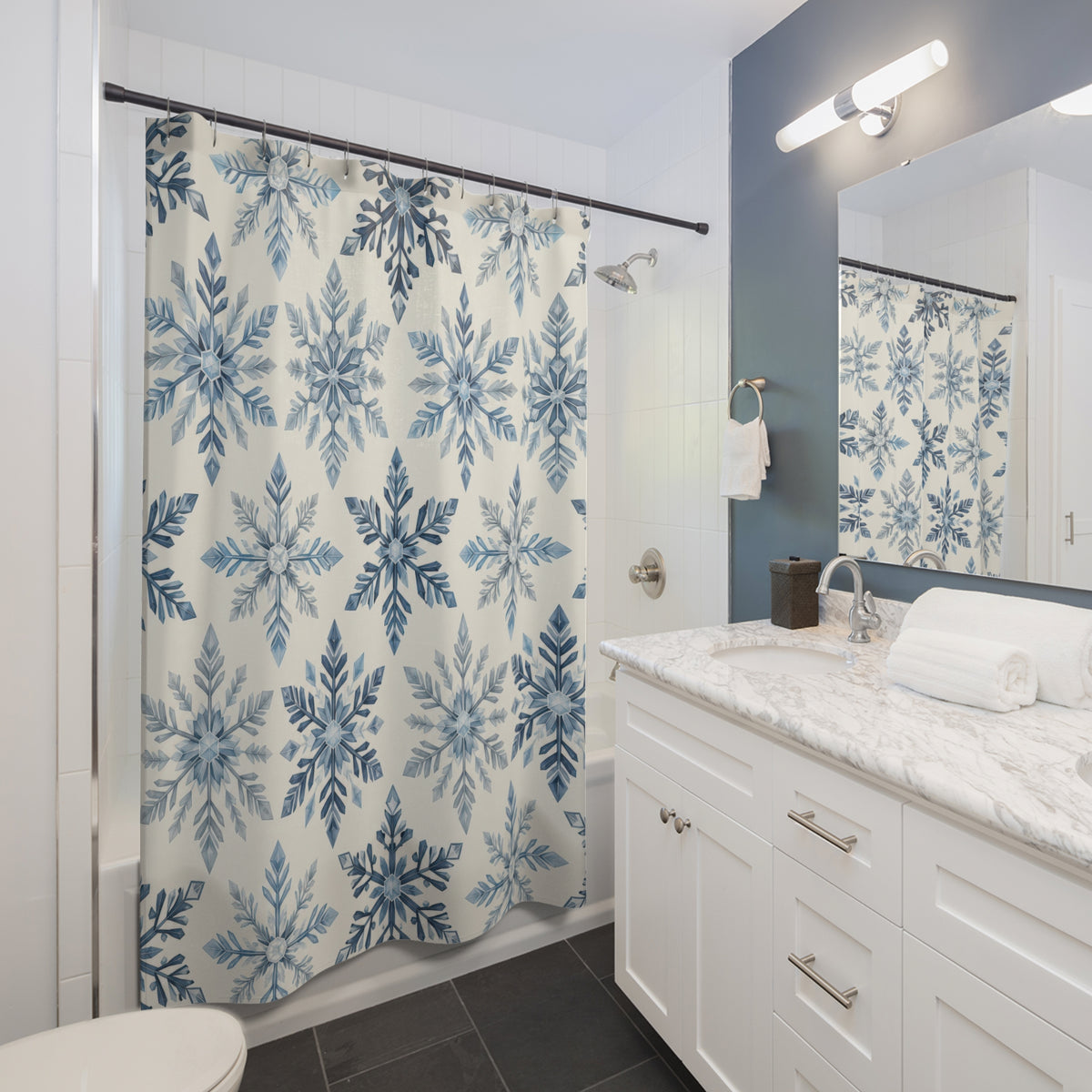 Blue ivory snowflake rosettes shower curtain beside a white vanity