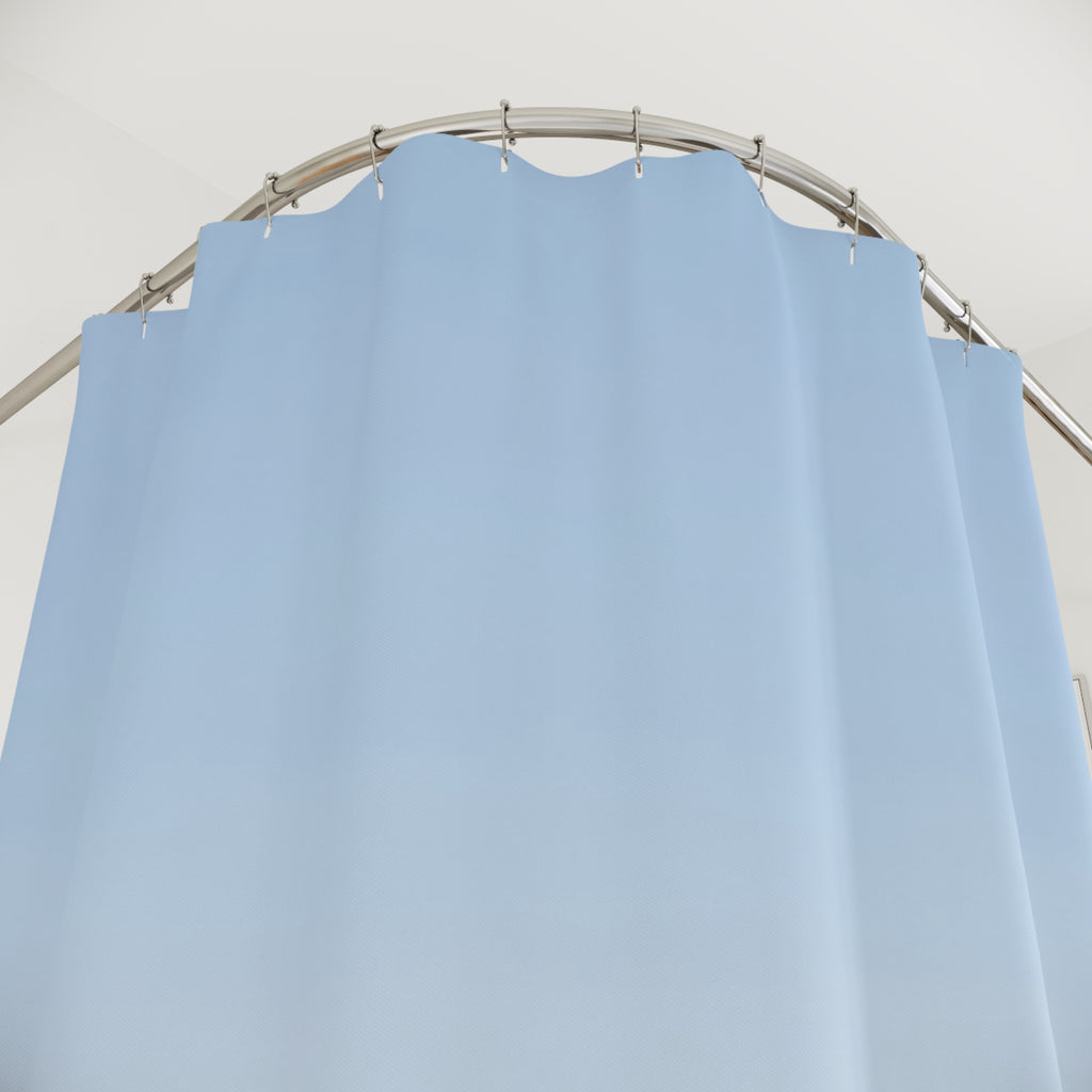 Layered pale blue, slate and indigo mountain ridges shower curtain with close-up print, hooks, and folds
