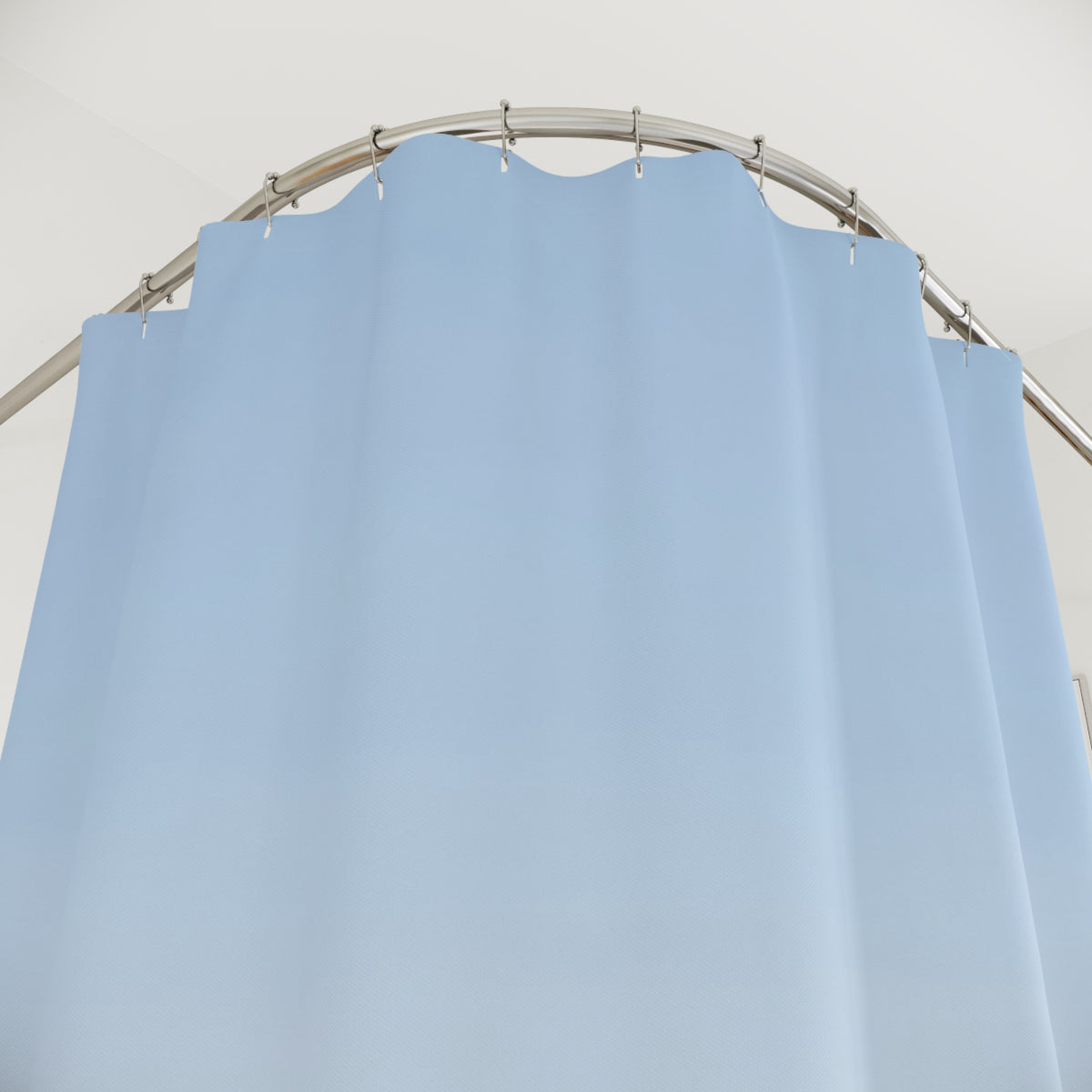 Layered pale blue, slate and indigo mountain ridges shower curtain with close-up print, hooks, and folds