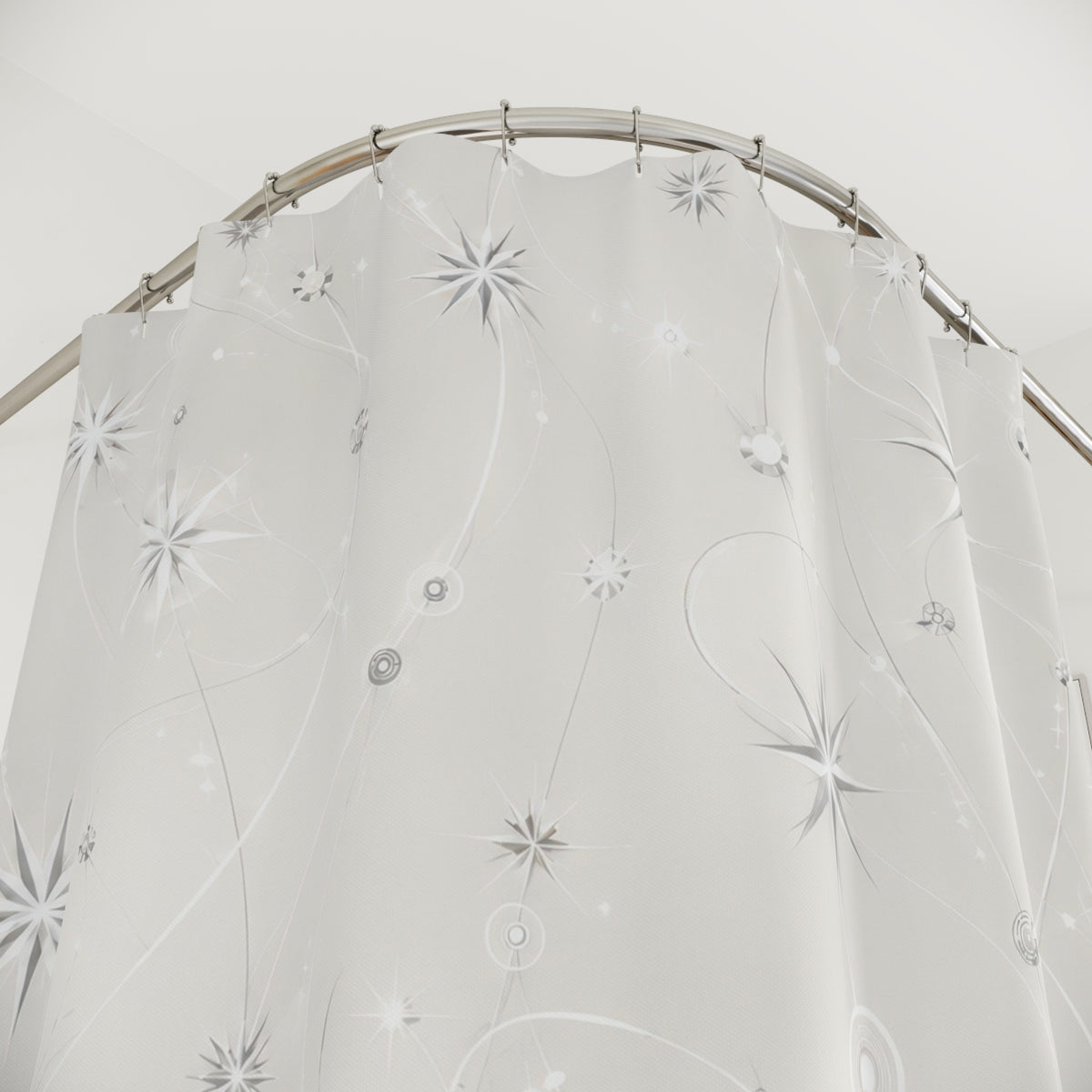Silver starbursts and faceted nodes linked by white orbit lines shower curtain with close-up print, hooks, and folds