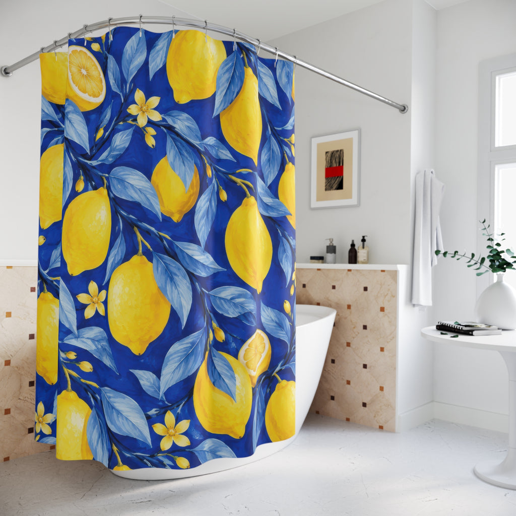 Yellow lemons and blossoms among blue leaves on cobalt shower curtain beside a freestanding tub