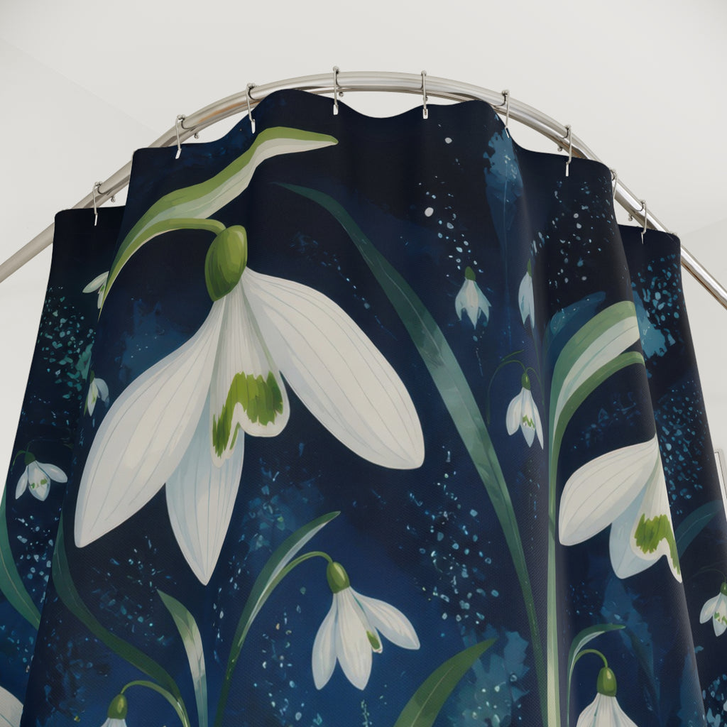 White winter snowdrops radiating over midnight blue shower curtain with close-up print, hooks, and folds