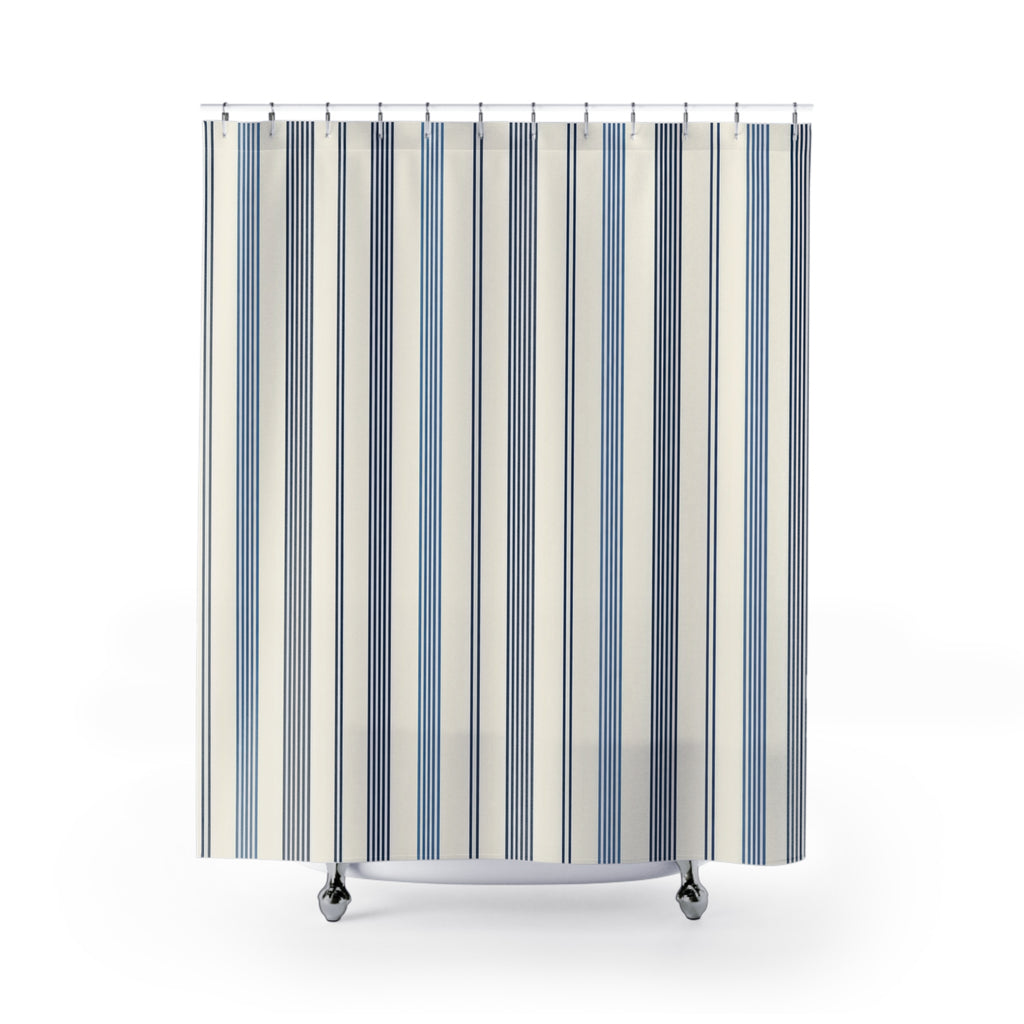 Navy and slate-blue pinstripe groups on warm ivory shower curtain with full front view