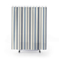 Navy and slate-blue pinstripe groups on warm ivory shower curtain with full front view