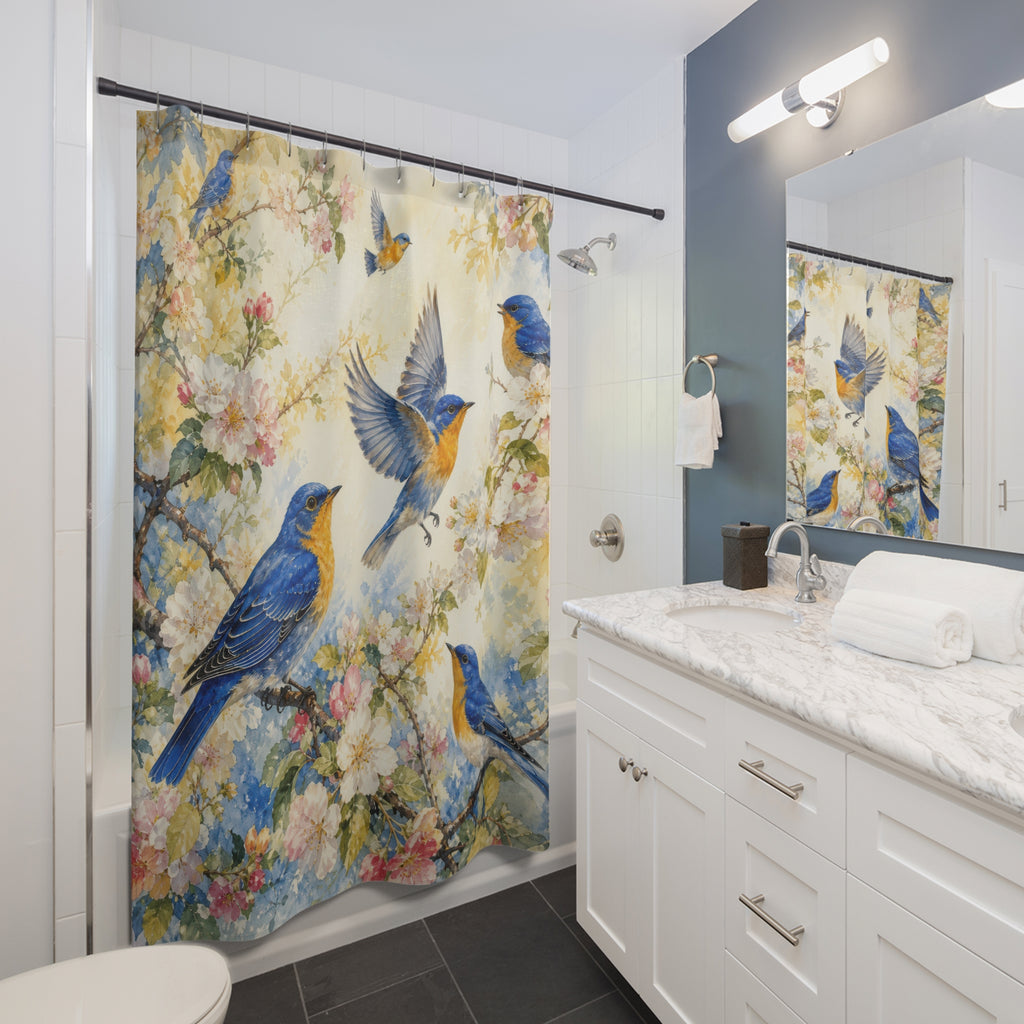 Blue and gold songbirds among blush blossoms on ivory shower curtain installed beside a white vanity
