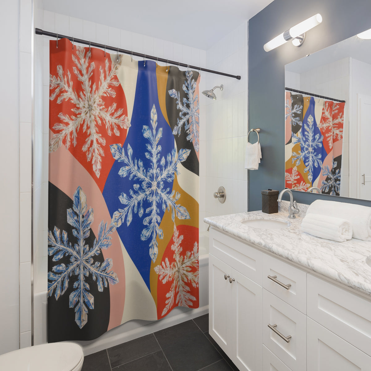 Color block snowflake crystals shower curtain beside a white vanity