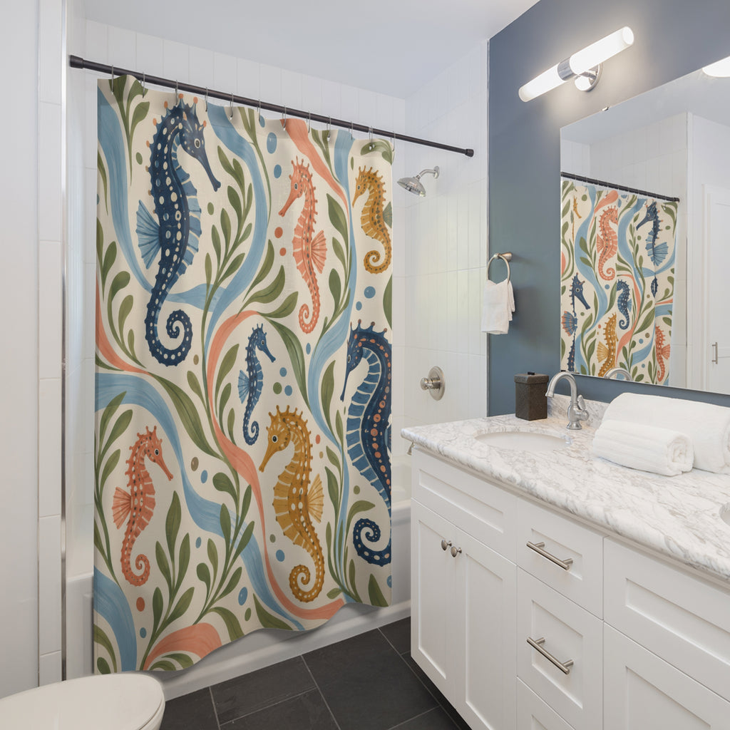 Navy coral and ochre seahorses on cream shower curtain beside a white vanity
