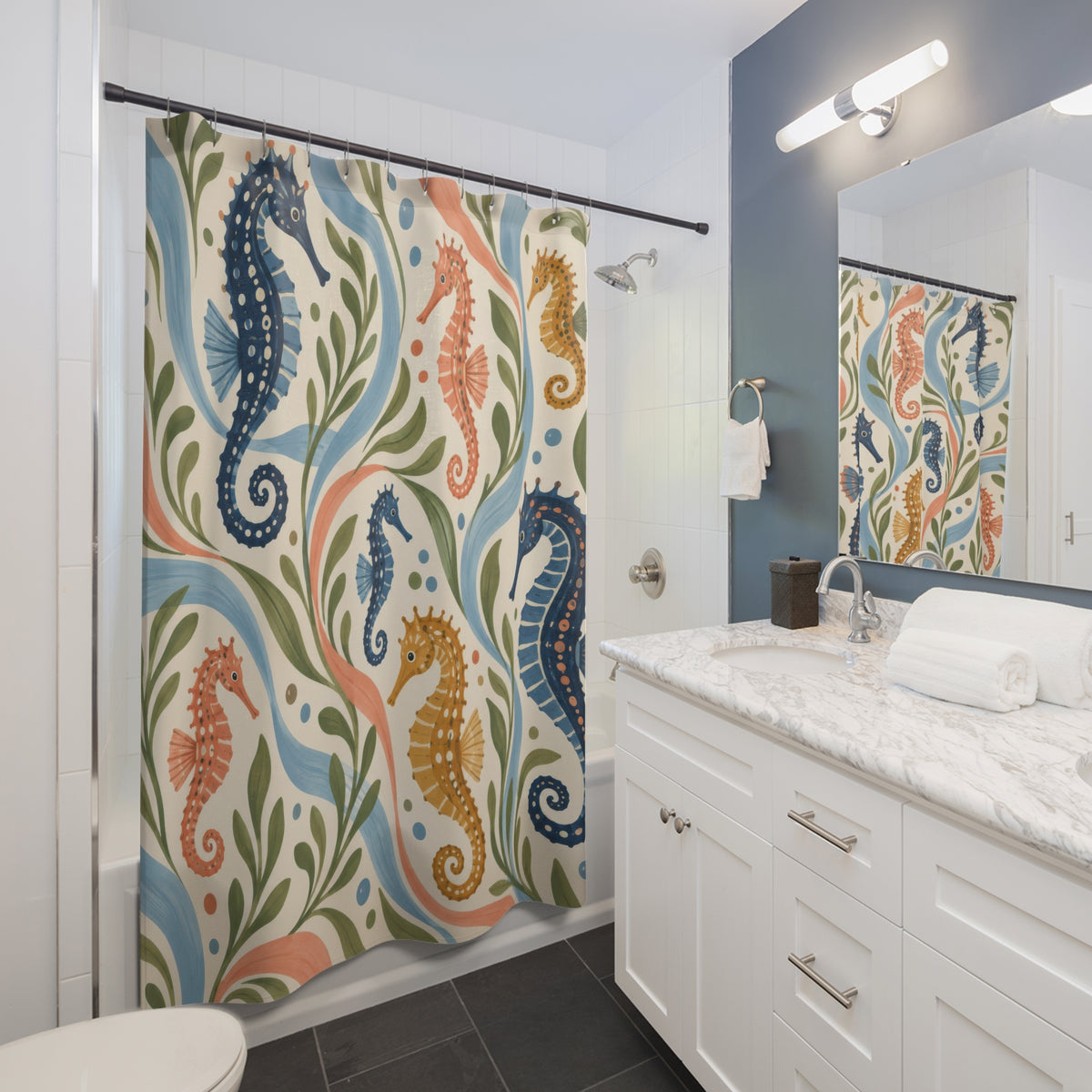 Navy coral and ochre seahorses on cream shower curtain beside a white vanity
