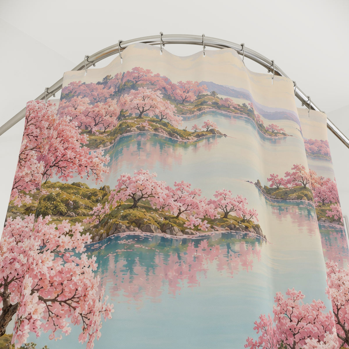 Pink cherry trees reflected in an aqua lake shower curtain with close-up print, hooks, and folds