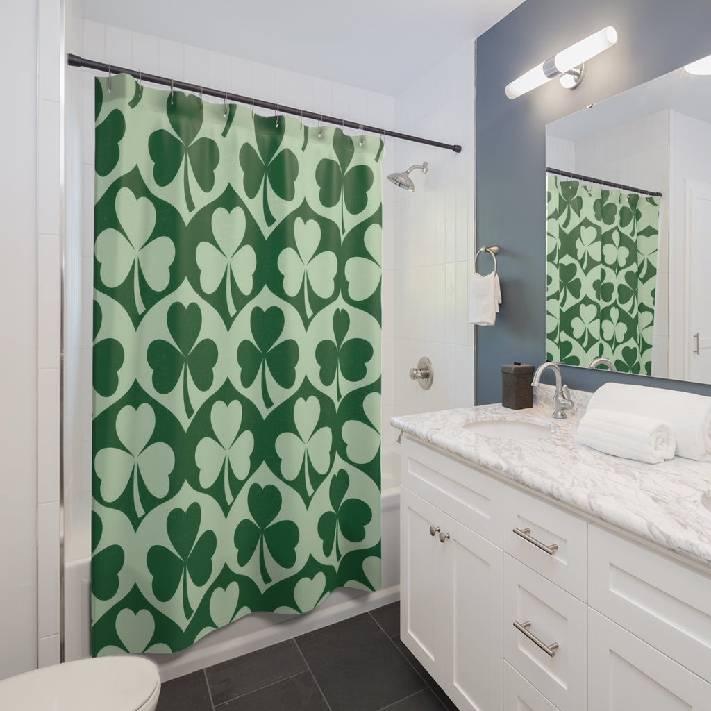 Emerald and mint green shamrock pattern shower curtain beside a white vanity