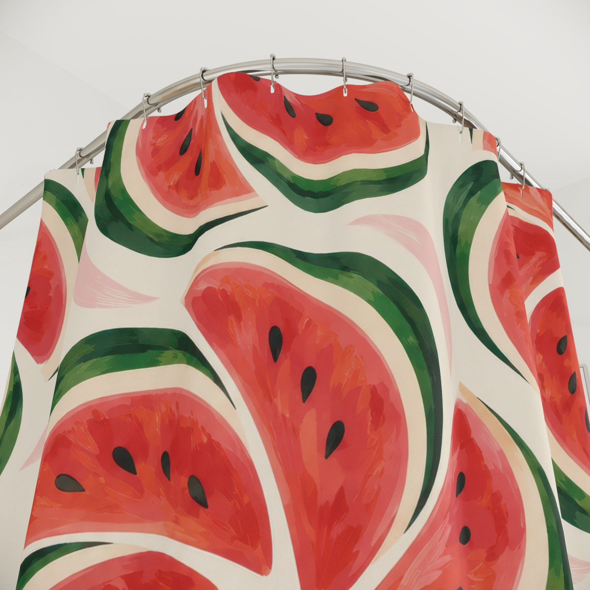 Coral-red watermelon pinwheels with green rinds on cream shower curtain with close-up print, hooks, and folds