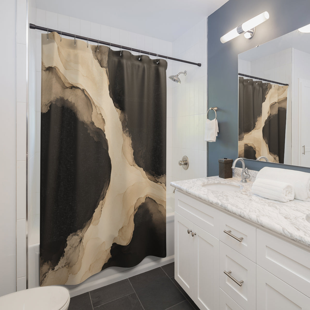 Beige and black fluid ink wash shower curtain beside a white vanity