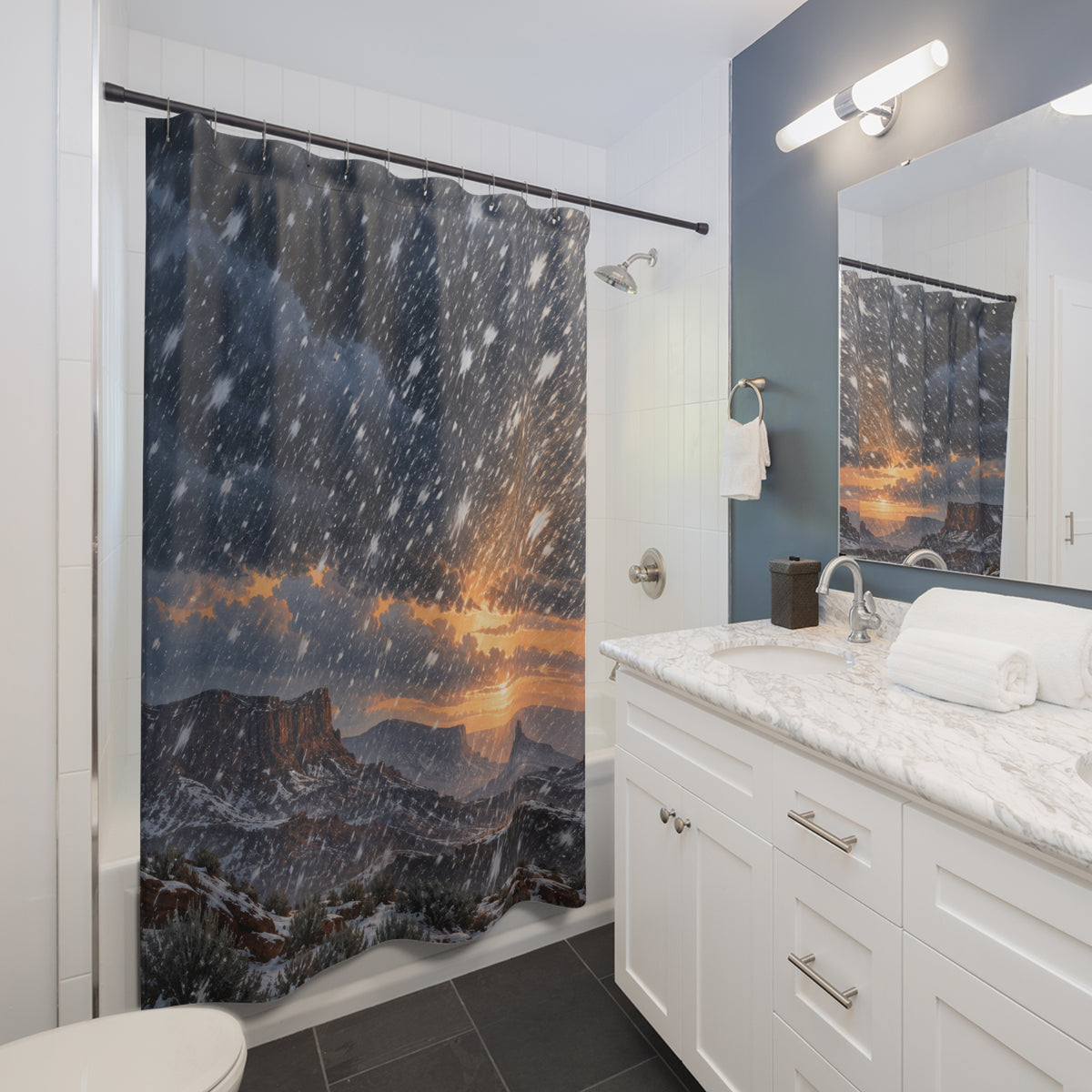 Western mesa snowfall shower curtain beside a white vanity