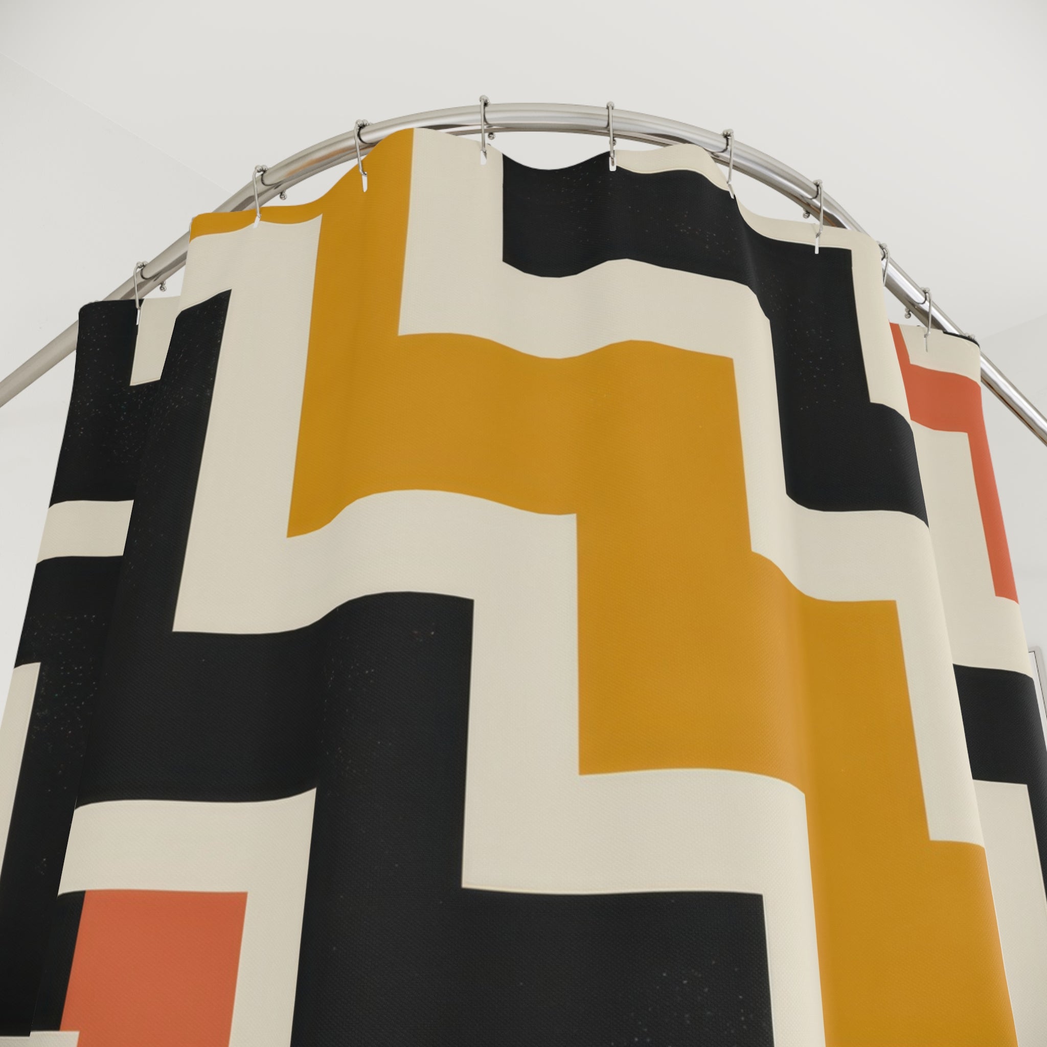 Mustard and black interlocking stepped zigzag labyrinth shower curtain with close-up print, hooks, and folds