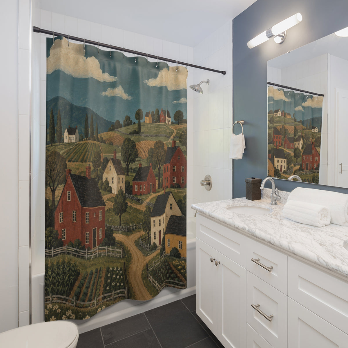 Red and cream saltbox houses among green fields and ochre paths shower curtain beside a white vanity