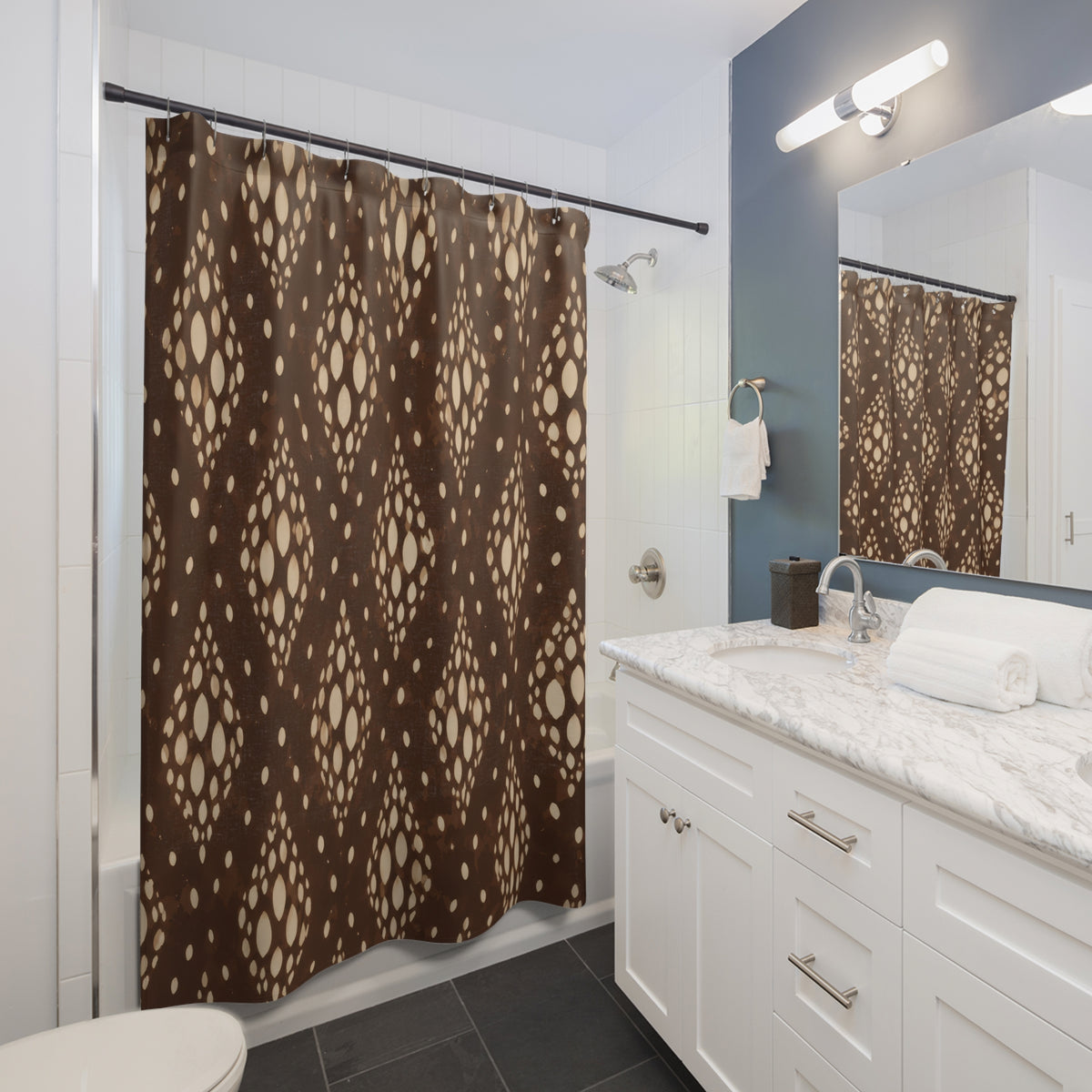 Cream fawn spot medallions over deep coffee brown shower curtain beside a white vanity
