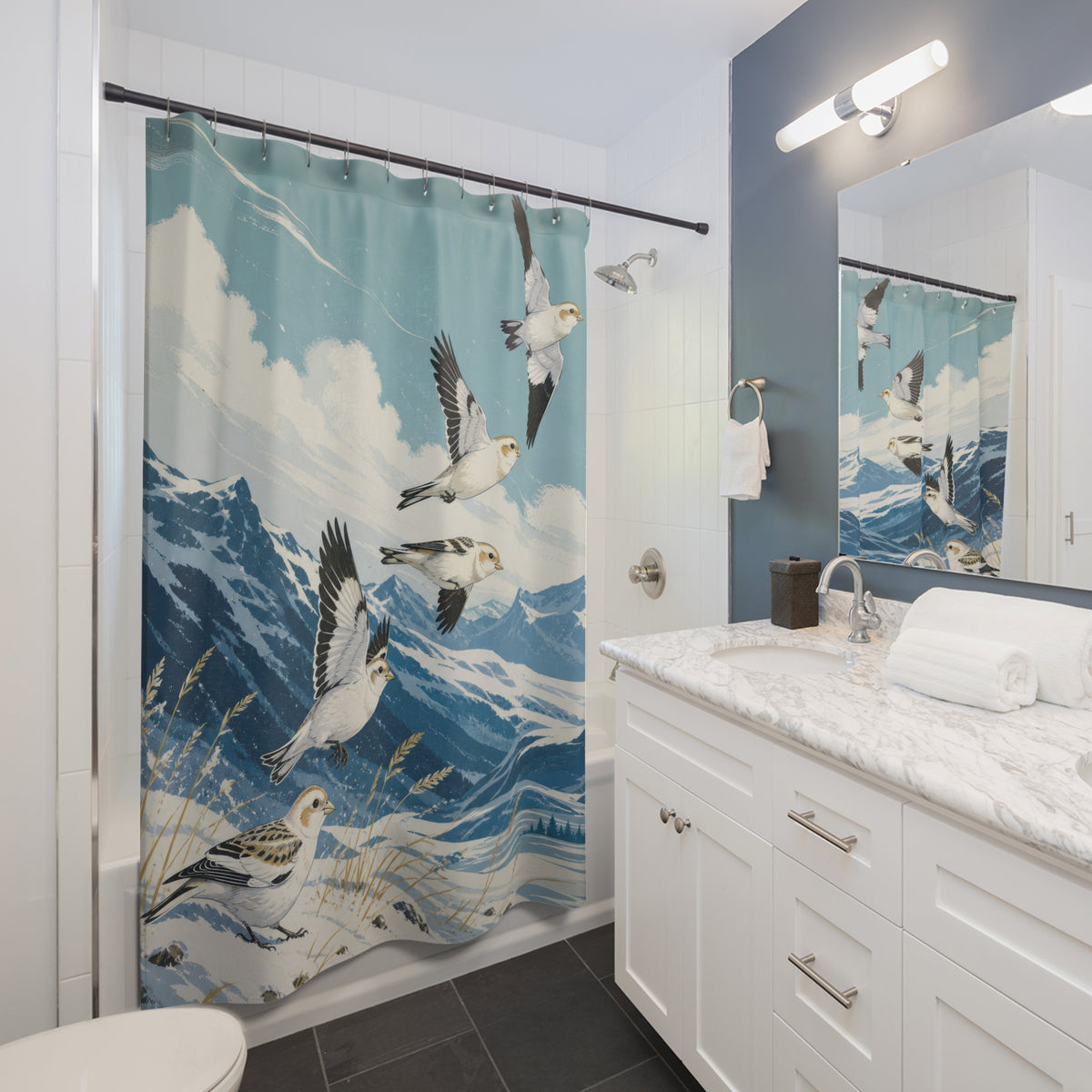 Snow buntings above blue mountains shower curtain beside a white vanity