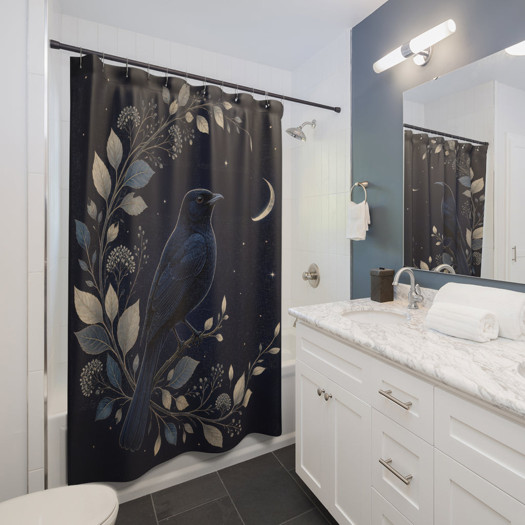 Blackbird framed by silver botanicals and a crescent moon shower curtain beside a white vanity