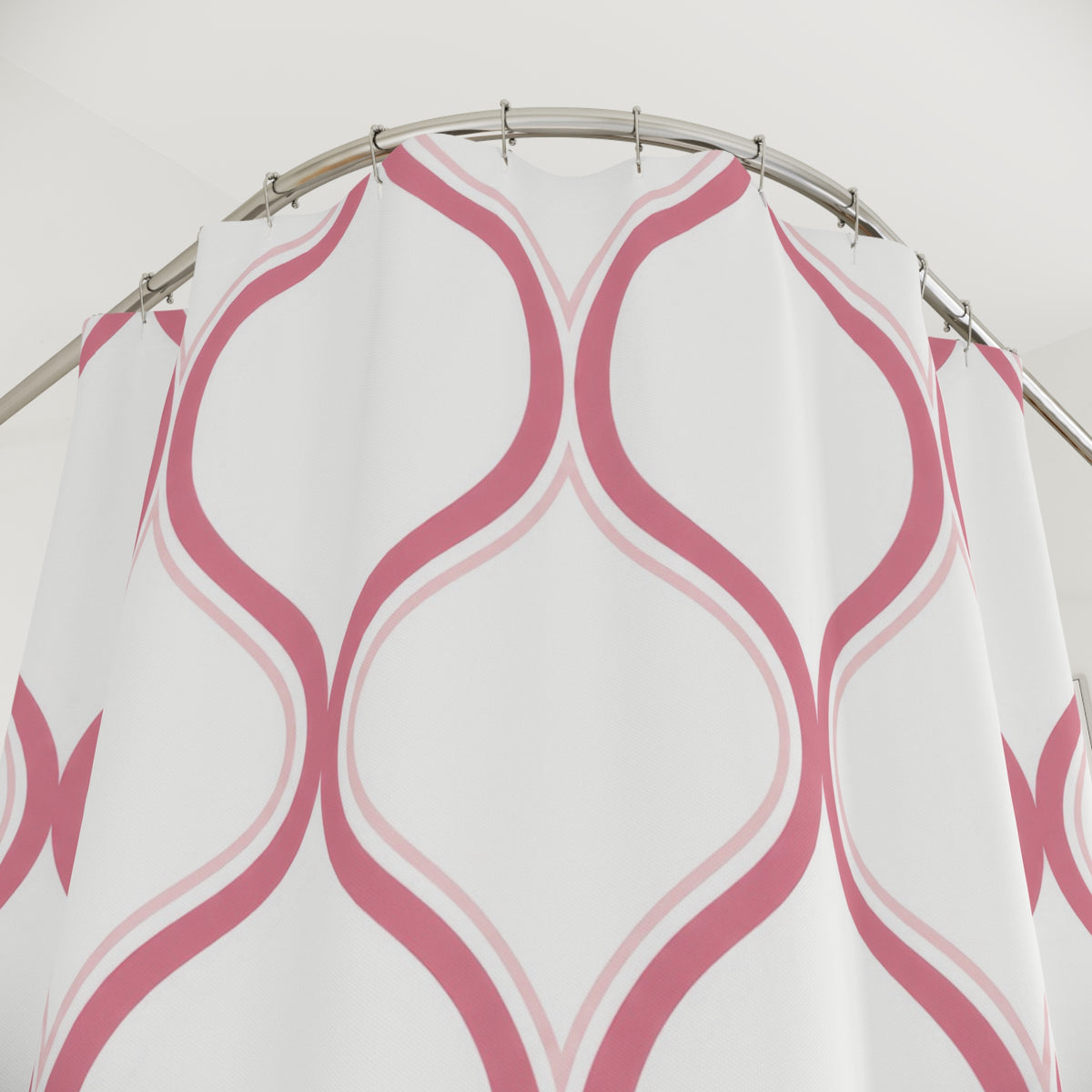 Rose ogee trellis with blush outlines on white shower curtain with close-up print, hooks, and folds