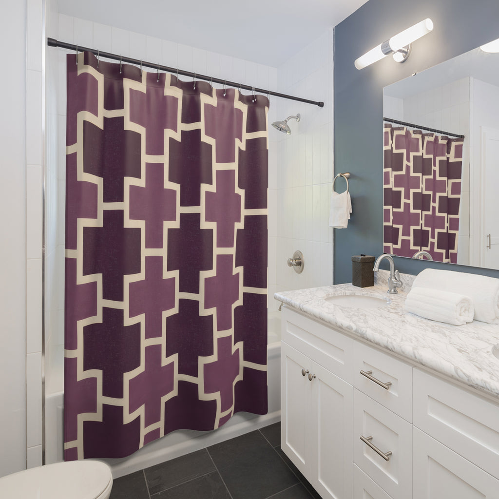 Plum crosses with cream outlines shower curtain beside a white vanity