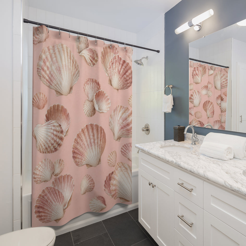 Ivory and rose seashells on blush pink shower curtain beside a white vanity