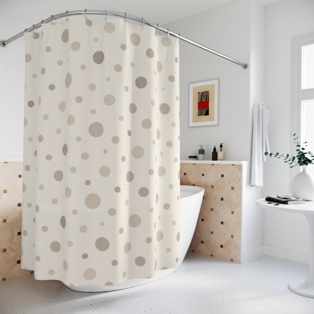 Neutral cream and taupe organic polka dots shower curtain beside a freestanding tub
