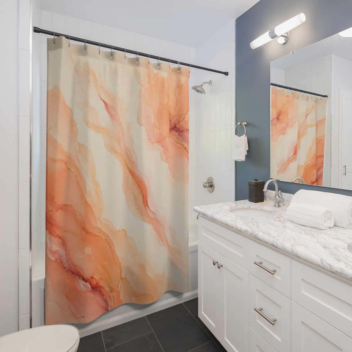 Peach mineral plume abstract shower curtain beside a white vanity