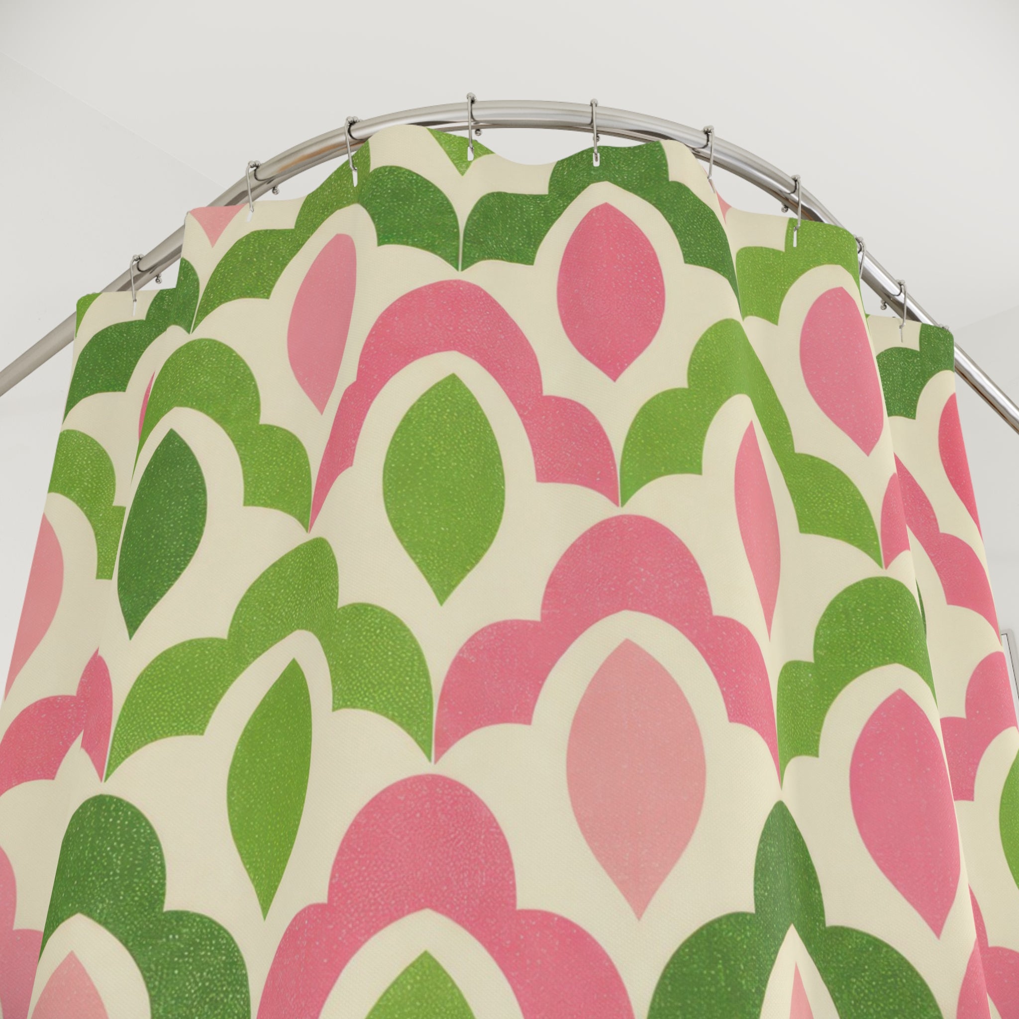 Green and pink interlocking scallop lattice shower curtain with close-up print, hooks, and folds