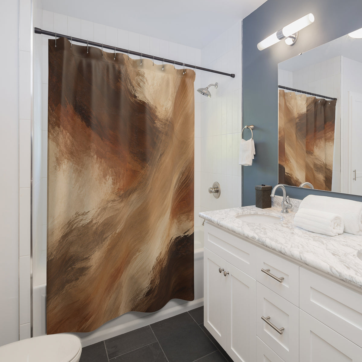 Umber and camel brushstrokes with cream openings shower curtain beside a white vanity