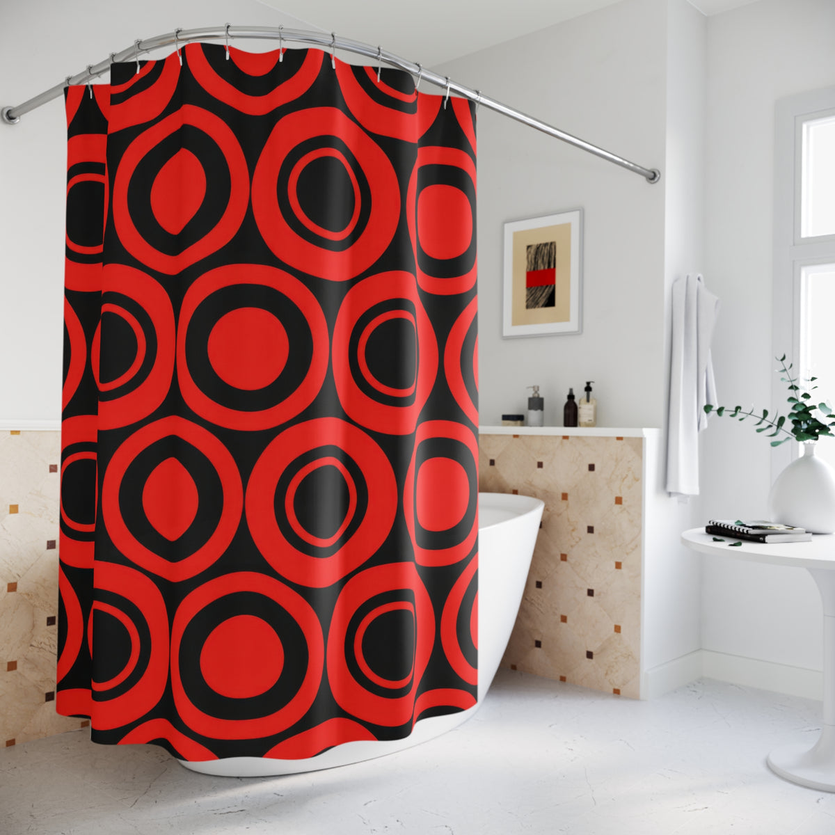 Red concentric circles and black circular bands shower curtain beside a freestanding tub