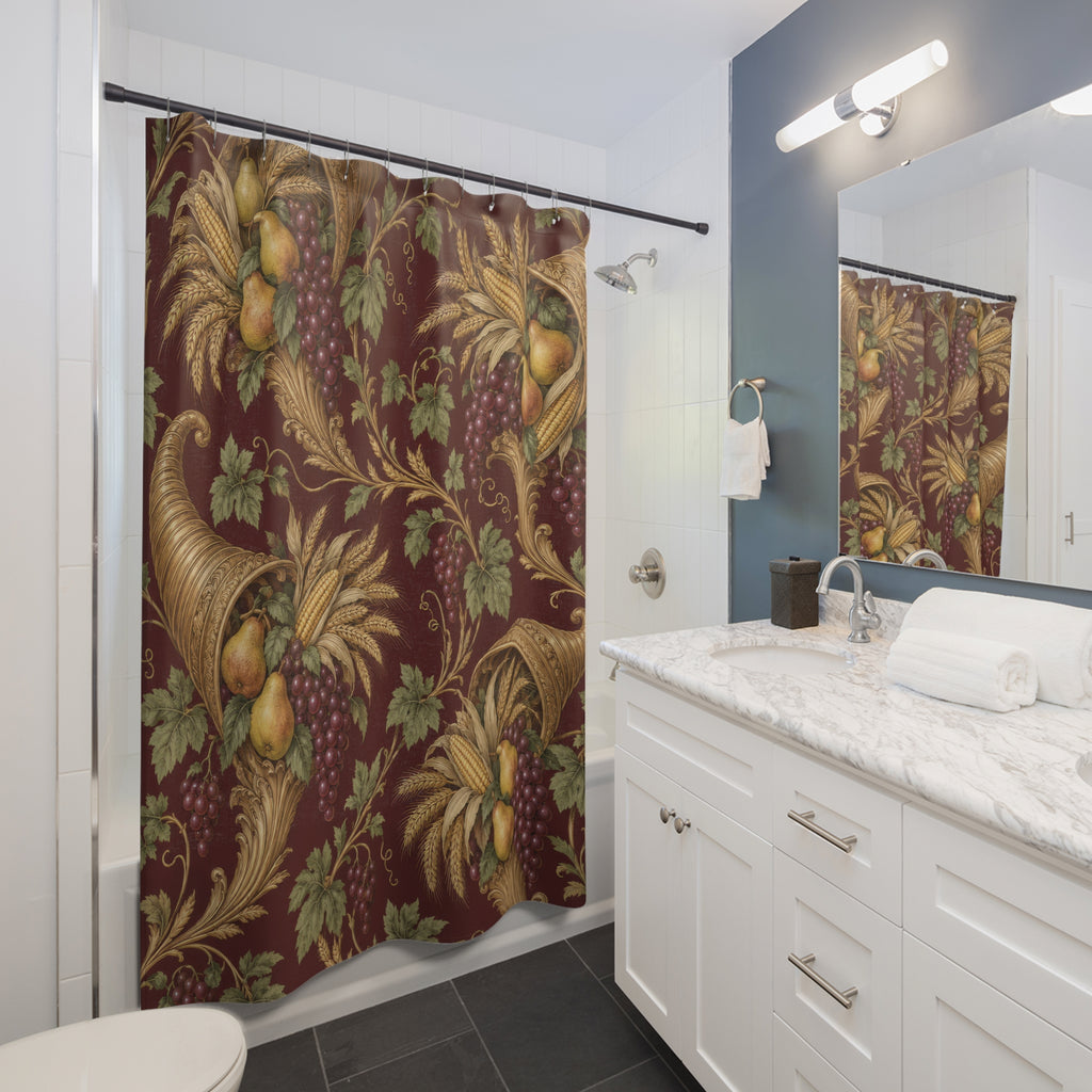 Gold cornucopias with pears and grapes on burgundy shower curtain beside a white vanity