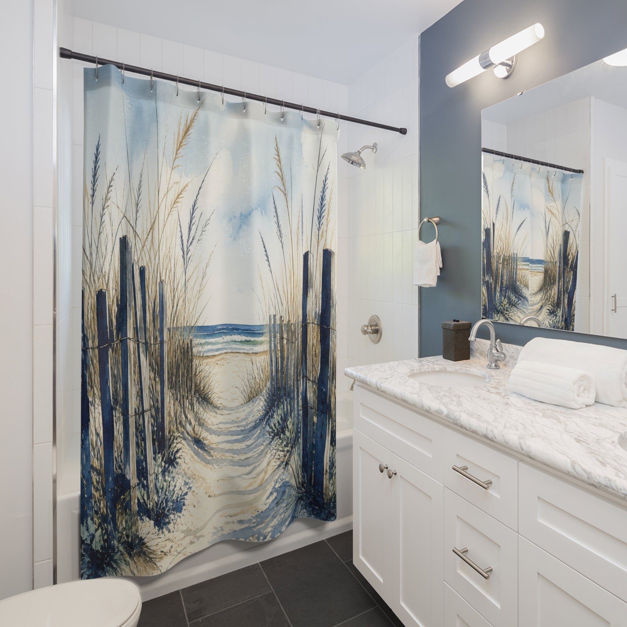 Navy dune fencing along a sandy path to the ocean shower curtain installed beside a white vanity