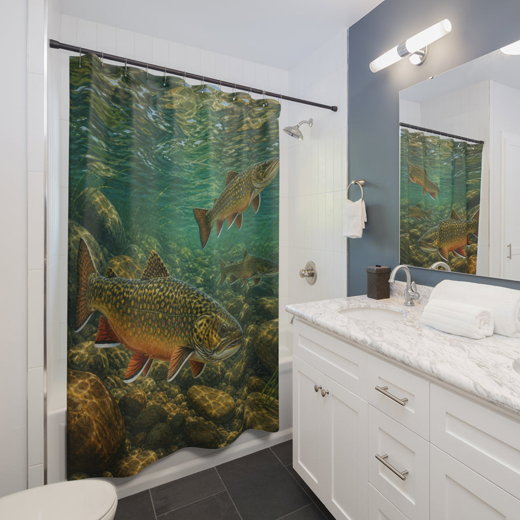 Speckled brook trout swimming above river stones in teal water shower curtain beside a white vanity