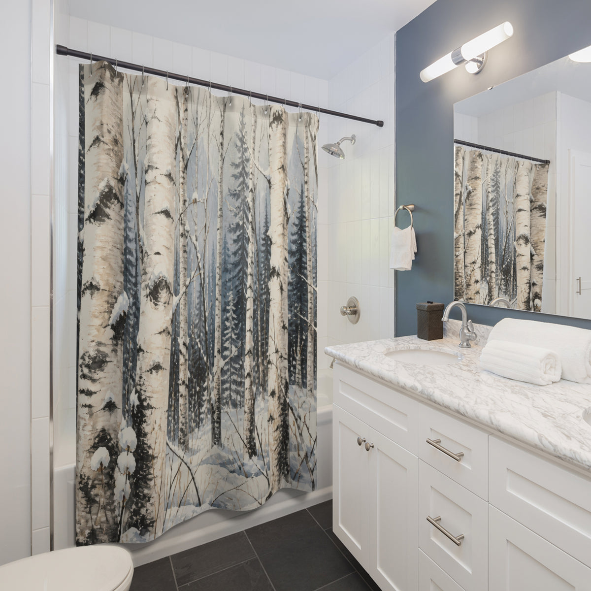 Winter woodland snowy birch grove pattern shower curtain beside a white vanity