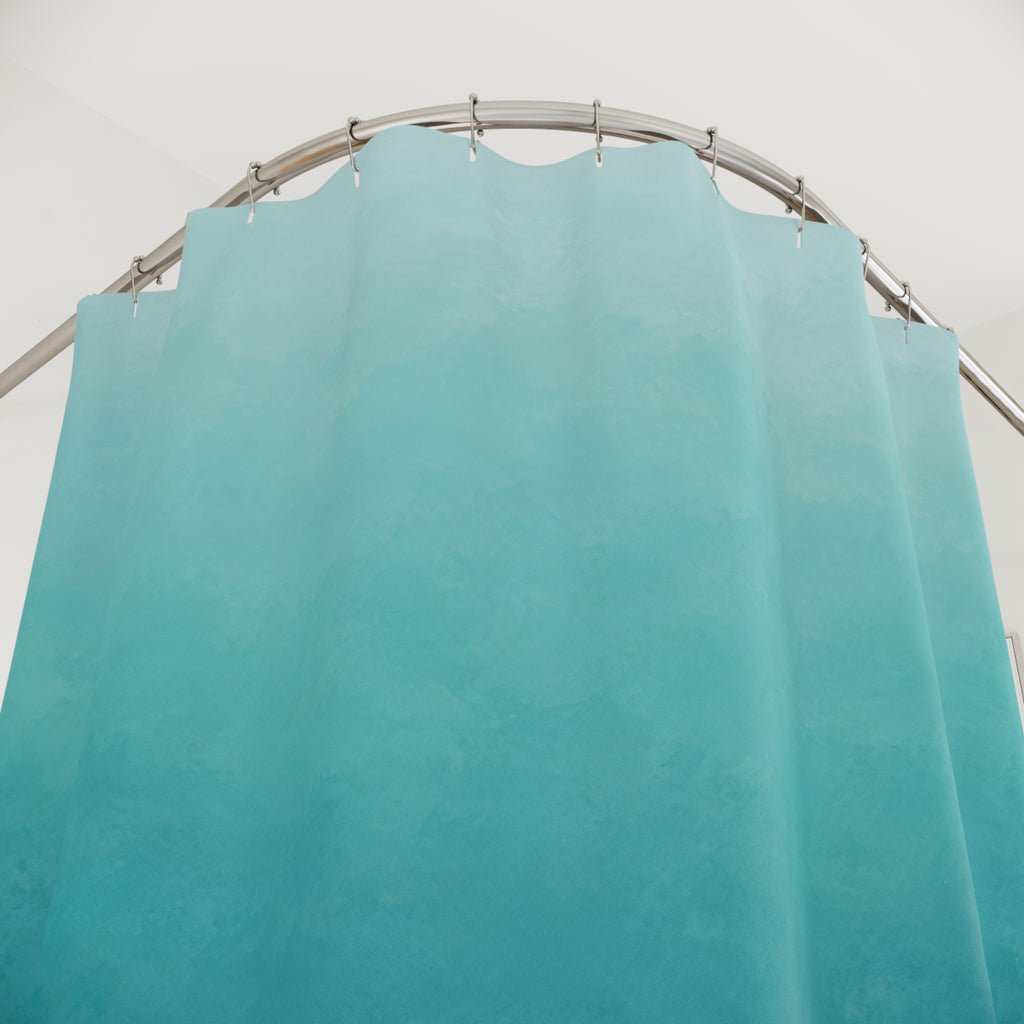 Aqua to deep blue ombre with teal midtones shower curtain with close-up print, hooks, and folds