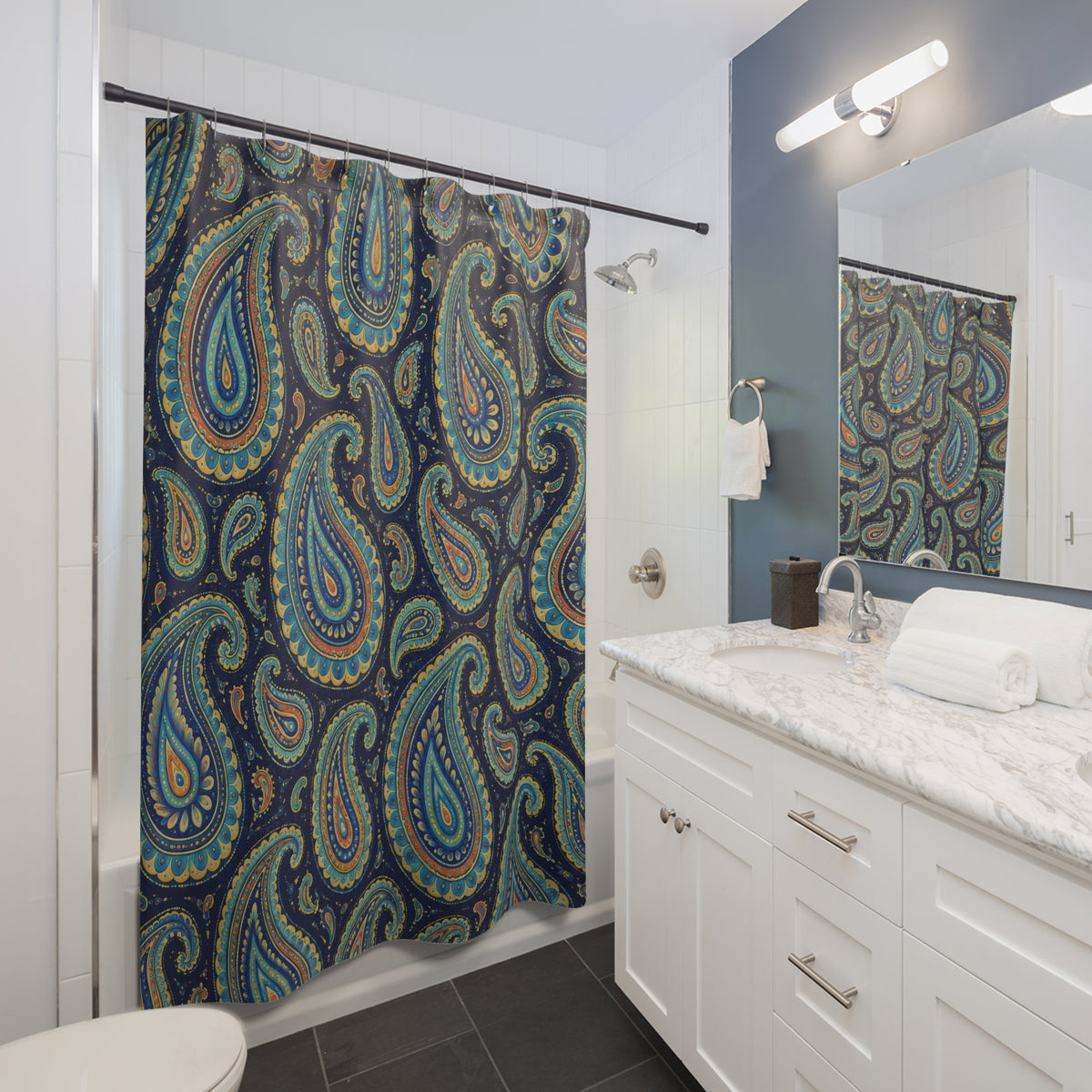 Turquoise paisley with golden yellow detail on navy shower curtain beside a white vanity
