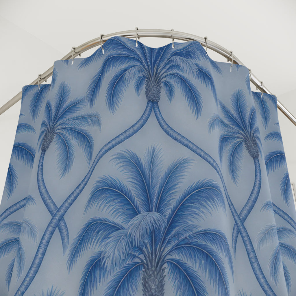 Blue palm trees with interlaced trunks on pale blue shower curtain with close-up print, hooks, and folds