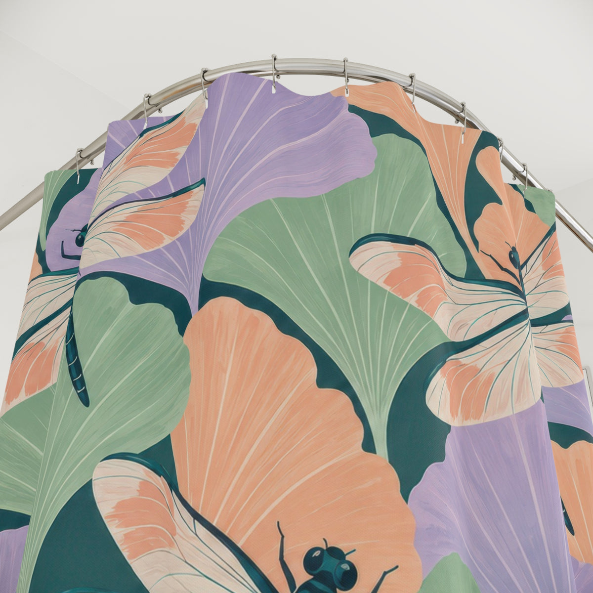 Pastel ginkgo leaves and teal dragonflies shower curtain with close-up print, hooks, and folds