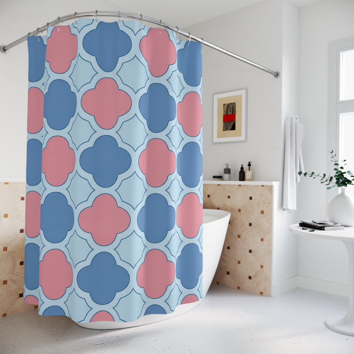 Blue and pink quatrefoils on a pale blue ground shower curtain beside a freestanding tub
