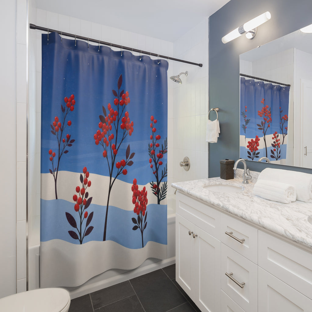 Red winter berry stems in layered blue snow shower curtain beside a white vanity