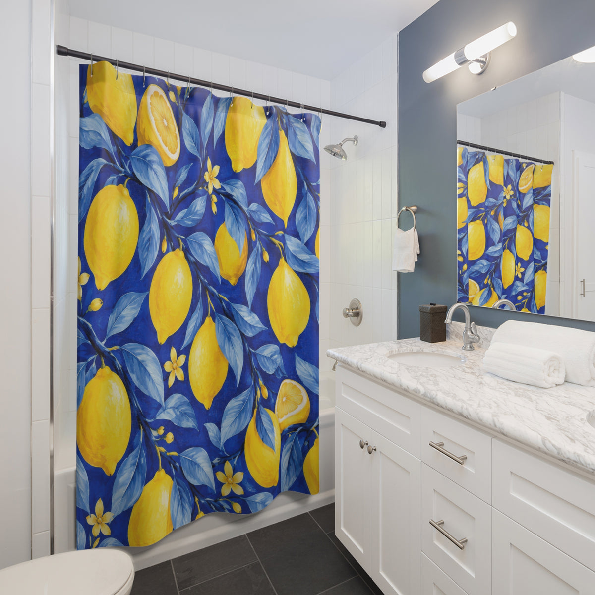 Yellow lemons and blossoms among blue leaves on cobalt shower curtain beside a white vanity