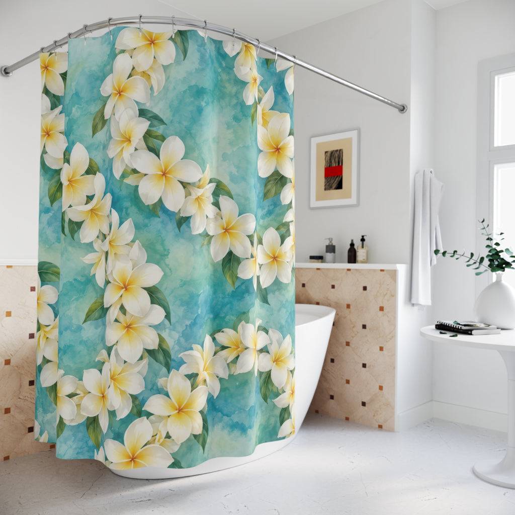 White plumeria leis over aqua watercolor shower curtain beside a freestanding tub