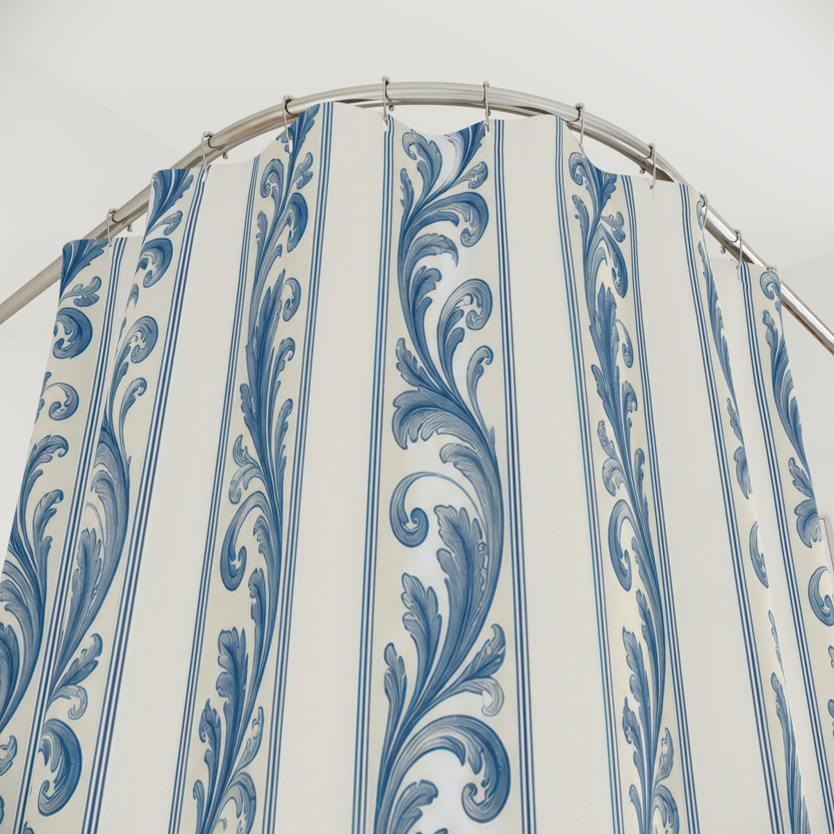 French-blue acanthus leaf stripes on warm ivory shower curtain with close-up print, hooks, and folds