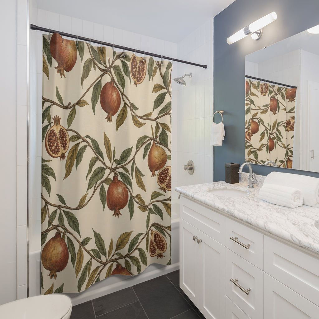 Russet pomegranates and olive leaves on cream shower curtain beside a white vanity