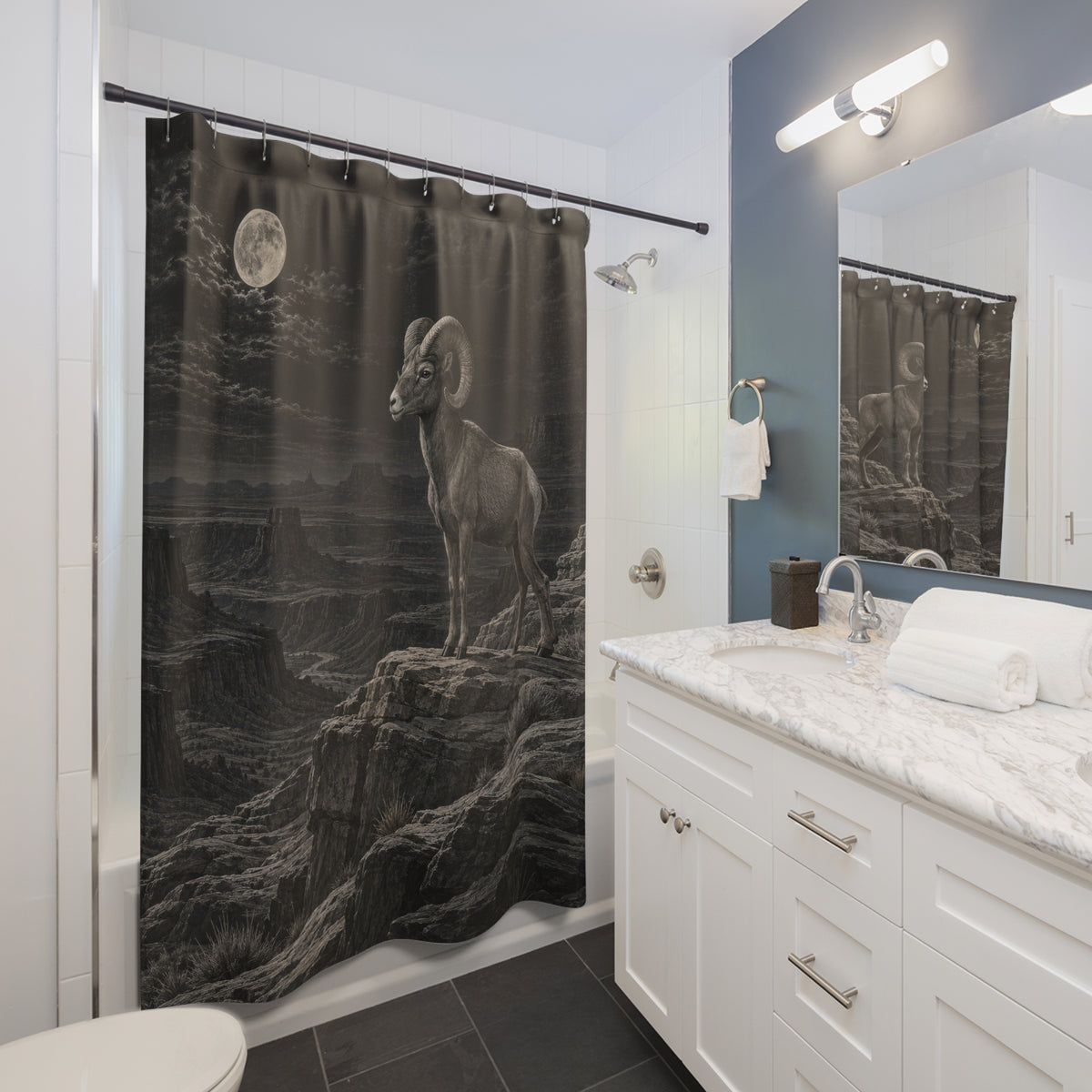 Bighorn sheep on a moonlit charcoal mountain ridge shower curtain beside a white vanity